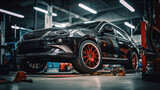 Black Sports Car with Red Rims in Auto Repair Shop
