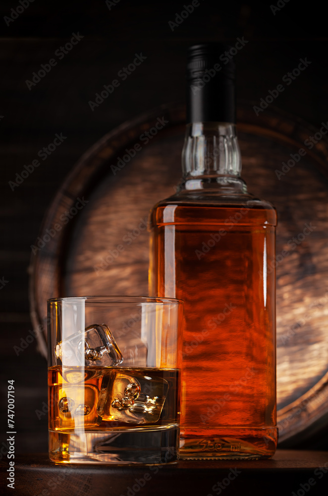 Glass and bottle with whiskey Glass and bottle with whiskey