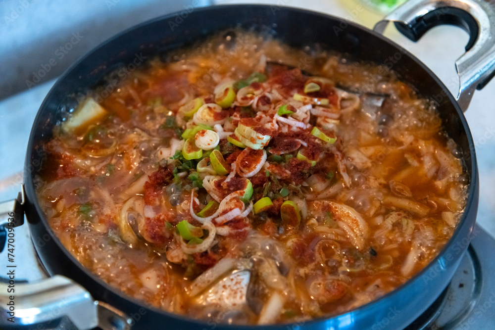 View of the boiling saury stew in the pot