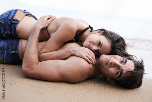 Couple, beach and lying with smile on vacation for bonding, love and break on summer in Mauritius. Relationship, holiday and travel for happiness with affection for memory, leisure and embrace.