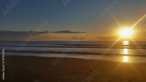 Colorful sunset on the shores of the Barents Sea. Varandey, Arctic, Russia.