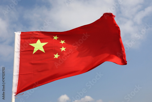 Flag of China on blue sky background