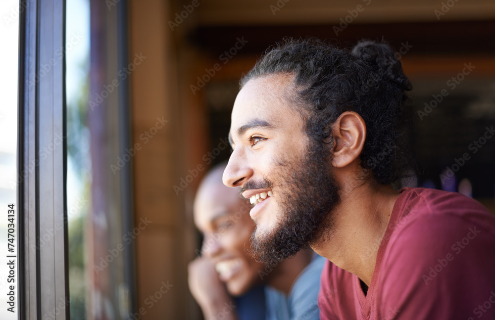 Face, smile and man at window of coffee shop to relax with view or enjoy free time off closeup. Cafe, customer and retail with happy young person in restaurant for service or hospitality industry