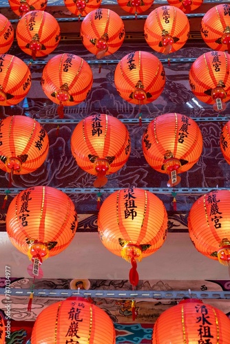 Riufang, Taiwan, 13 february 2024. Rows of chinese red lanterns inside the city temple. Religion symbol. photo