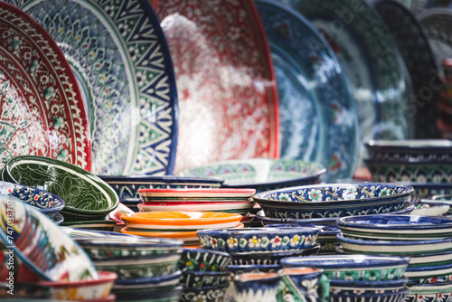 Multi-colored ceramic products with oriental ornaments at the Siab Bazaar in the ancient city of Samarkand in Uzbekistan, Siyob bozor photo