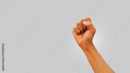 clasping hand gesture on a light gray background