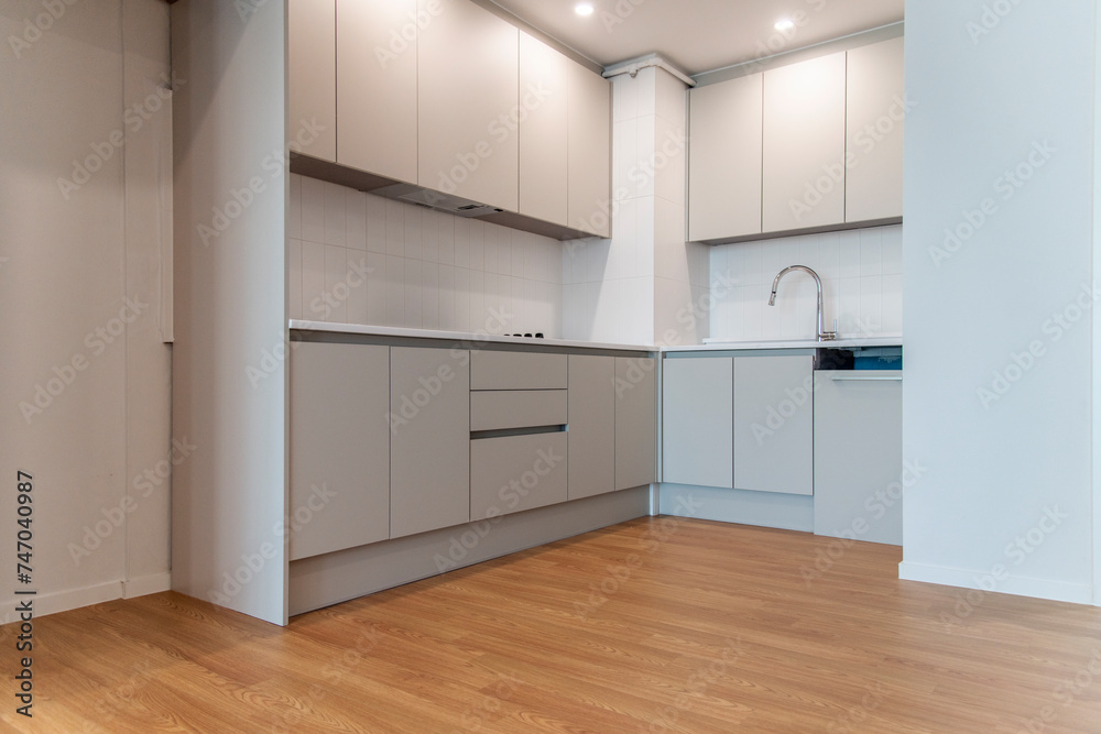 The interior of the renovated kitchen in the apartment The interior of the renovated kitchen in the apartment