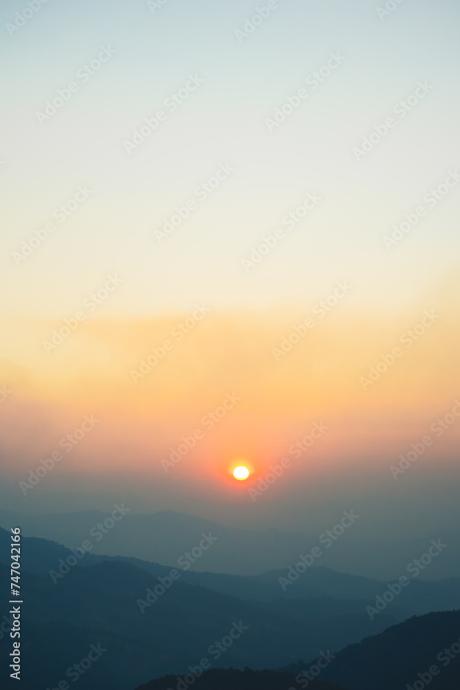 Fototapeta premium landscape and travel concept with sunset and twilight sky with layer of mountain