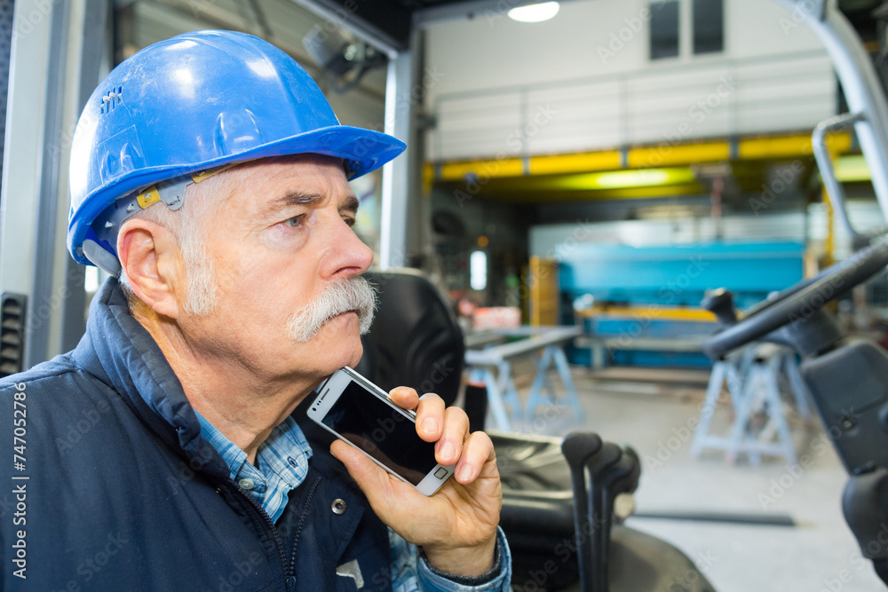 elderly man wearing blue hardhat elderly man wearing blue hardhat