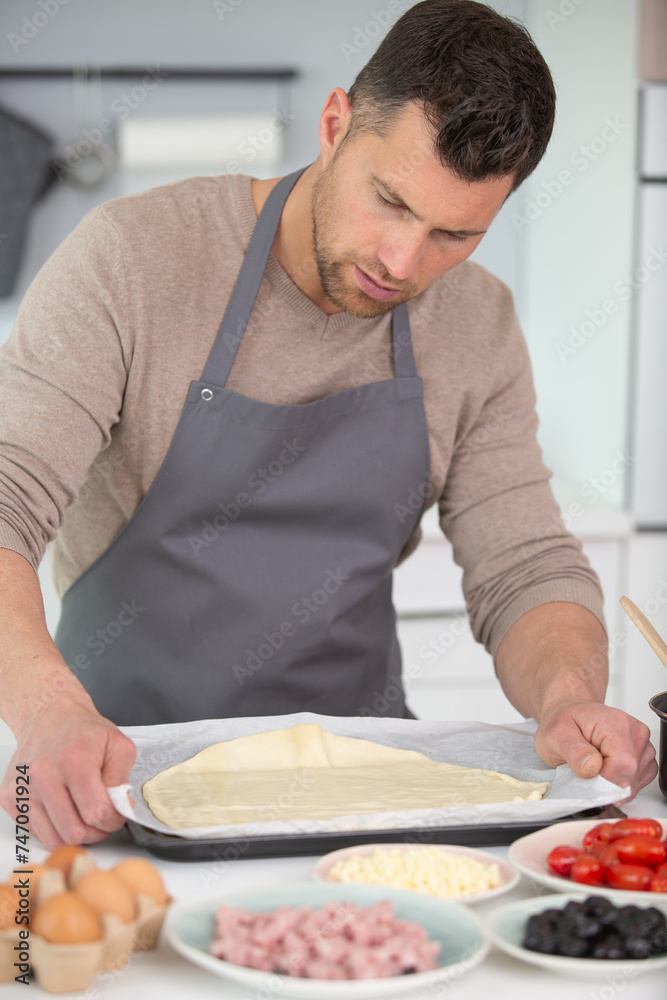 man spiting yeast in dough making process man spiting yeast in dough making process
