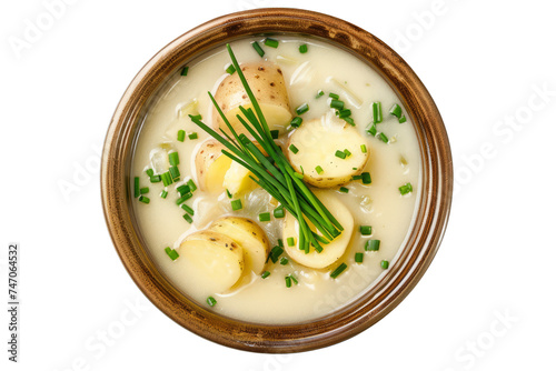 Irish potato soup with potatoes, onions, leeks, celery, and cream in a smooth and creamy broth, garnished with chives. No background needed, just a single color.