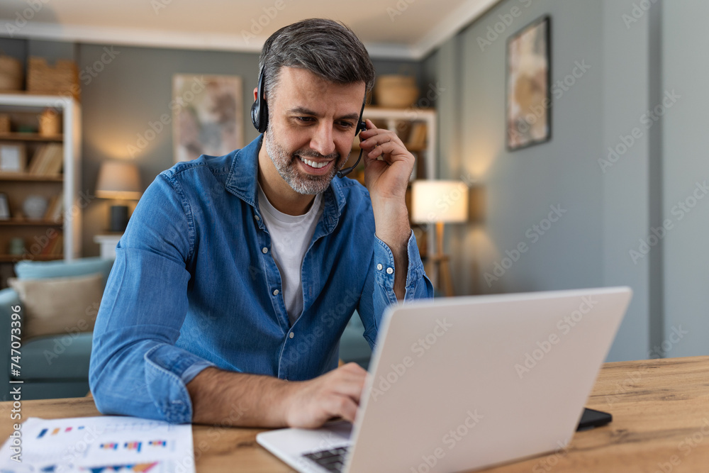 Friendly operator man agent with headsets. business man wearing microphone headset working in the office as a telemarketing customer service agent, call center job concept.