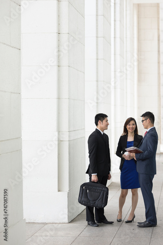 Asian Business colleagues talking