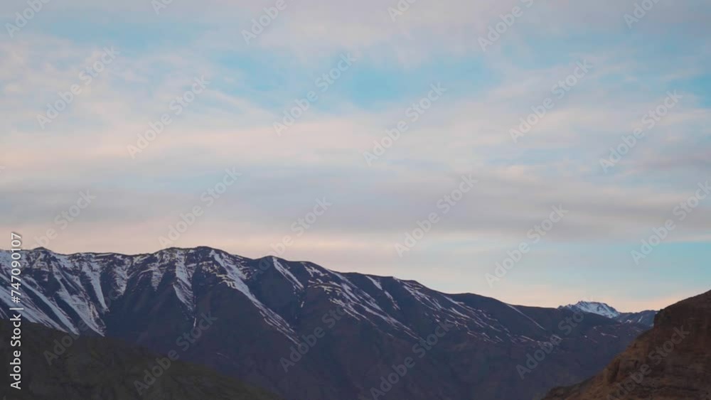 Snow covered Himalayan mountain peaks during sunset as seen from Nako Village in Kinnaur, Himachal Pradesh, India. View of Himalayan mountains on the way to Spiti Valley in India. Snow covered Himalayan mountain peaks during sunset as seen from Nako Village in Kinnaur, Himachal Pradesh, India. View of Himalayan mountains on the way to Spiti Valley in India.