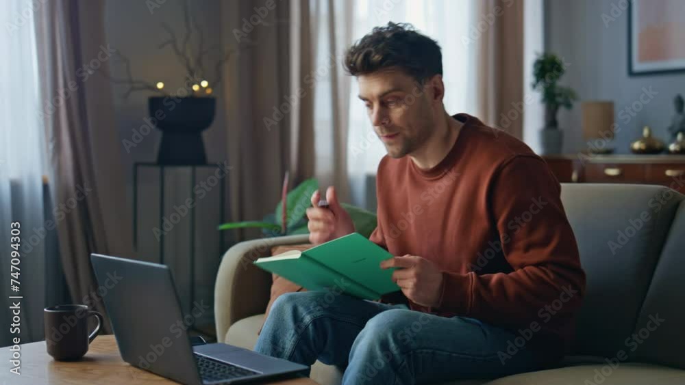 Manager talking video conference looking laptop web camera on home couch. Manager talking video conference looking laptop web camera on home couch.