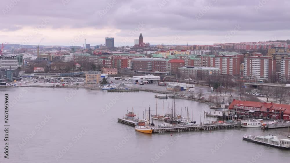 Establishing drone flight over Gothenburg harbor with city skyline view, Sweden Establishing drone flight over Gothenburg harbor with city skyline view, Sweden