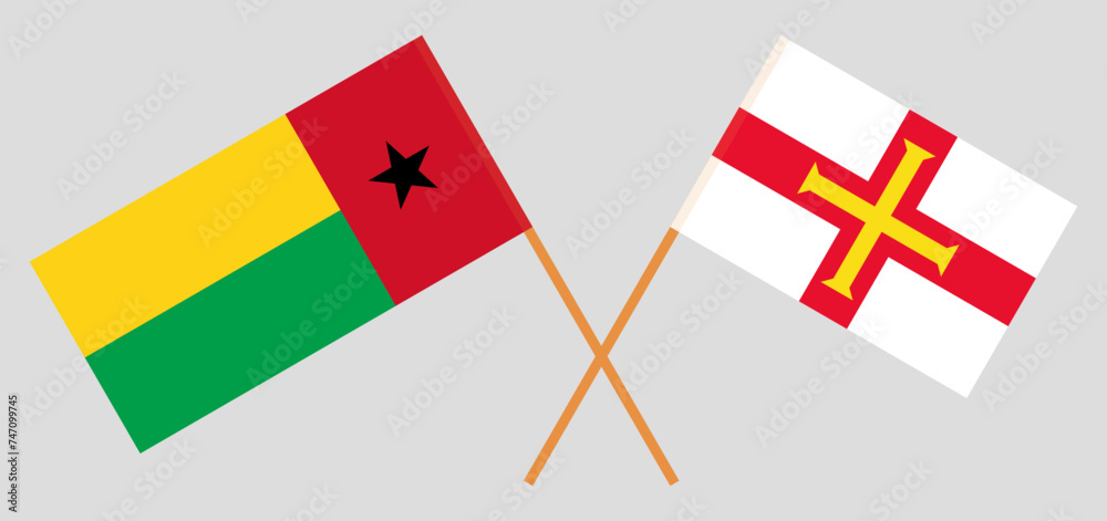 Crossed flags of Guinea-Bissau and Bailiwick of Guernsey. Official colors. Correct proportion
