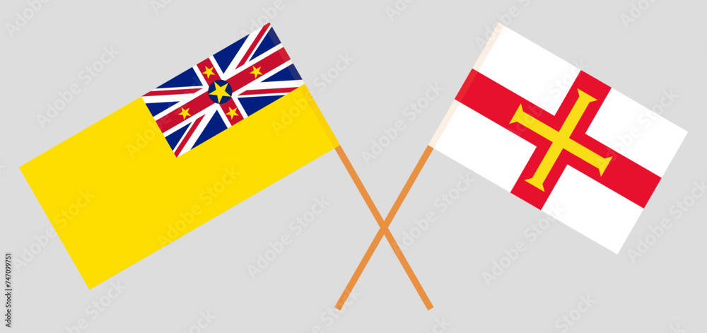 Crossed flags of Niue and Bailiwick of Guernsey. Official colors. Correct proportion
