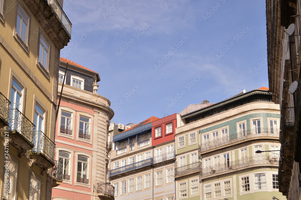 Top of three facades of old buildings in downtown Porto in Portugal