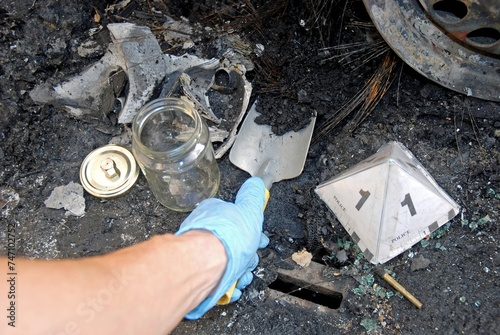 Photos The Scientific Police, CSI, Collecting samples of charred remains burned in an a