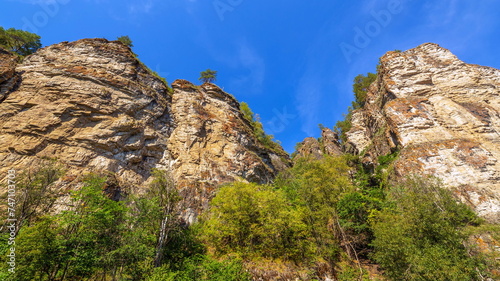 beautiful ancient high rocks on the banks of the river ai on a summer sunny day