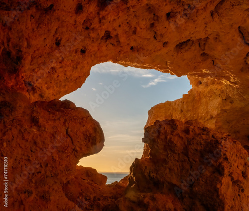 Sunset at the end of a tunnel Algar seco cliffs and caves  Carvoeiro  Lagoa  Algarve  Portugal.