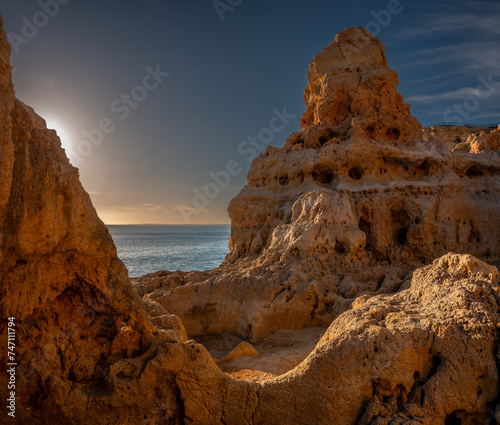 Surreal limestone rock formations on the shores of the Atlantic ocean, Algar seco cliffs, Carvoeiro, Lagoa, Algarve, Portugal.