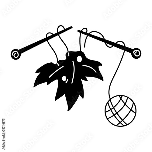 Modern glyph icon depicting knitting leaf 