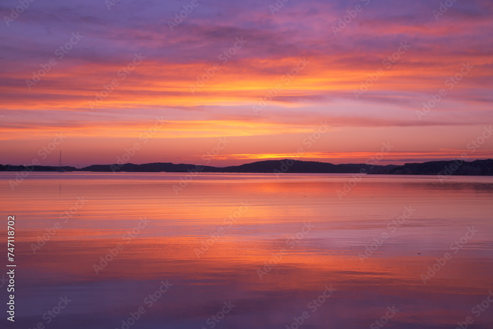 Scenic view of sunset with pink sky reflected in water