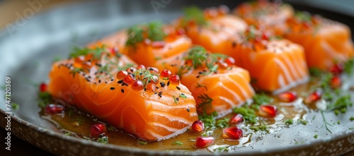 Sliced salmon sashimi garnished with herbs and pomegranate on a rustic plate, a delicacy prepared with care