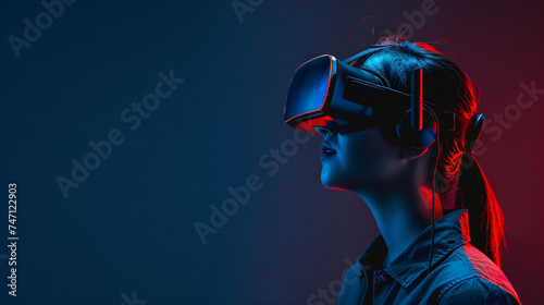 Woman watching with VR with red and blue lights.
