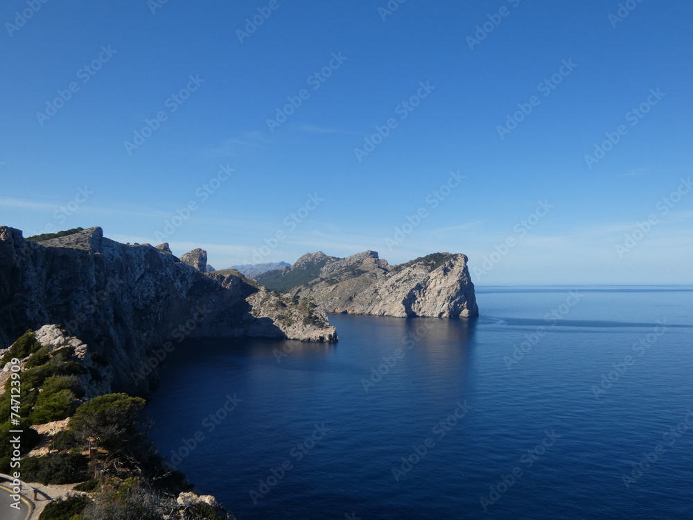 Scenic view of blue ocean water and rocky cliff coast
