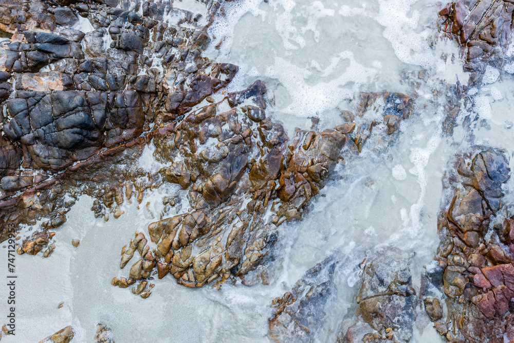 Stones on the sandy beach. There is space for entering text. Stones on the sandy beach. There is space for entering text.