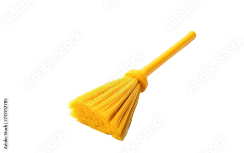 Yellow Broom. A yellow broom is creating a stark contrast between the bright color of the broom and the clean backdrop. The broom appears to be in a clean and unused condition.