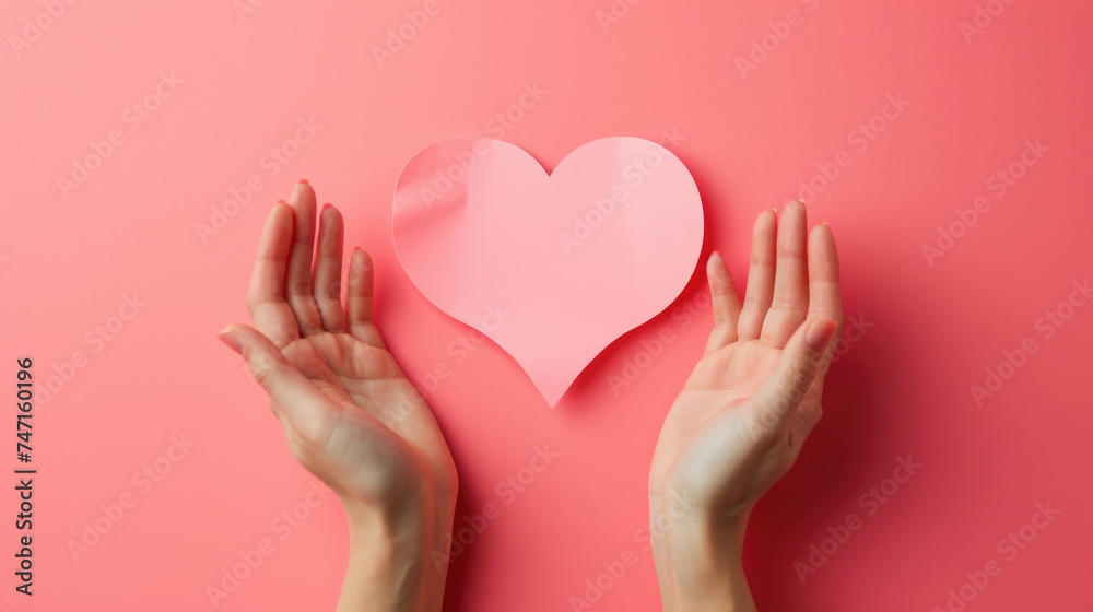 Two hands holding paper heart, suitable for love or Valentine's Day concept Two hands holding paper heart, suitable for love or Valentine's Day concept