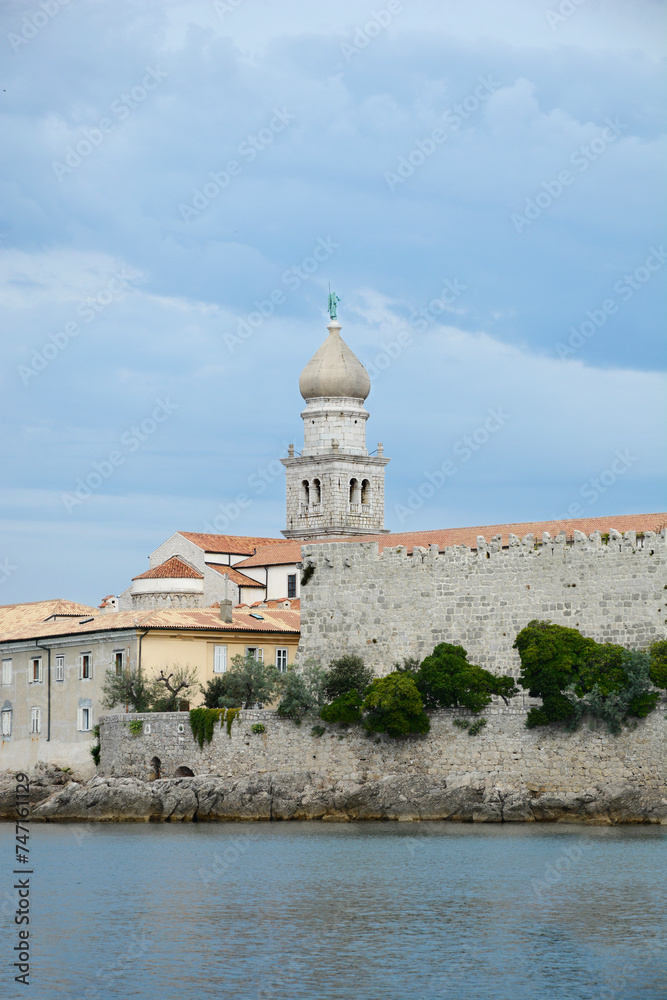 View of the Church of Assumption of the Blessed Virgin Mary and fortress walls in Krk, on Krk island in Croatia