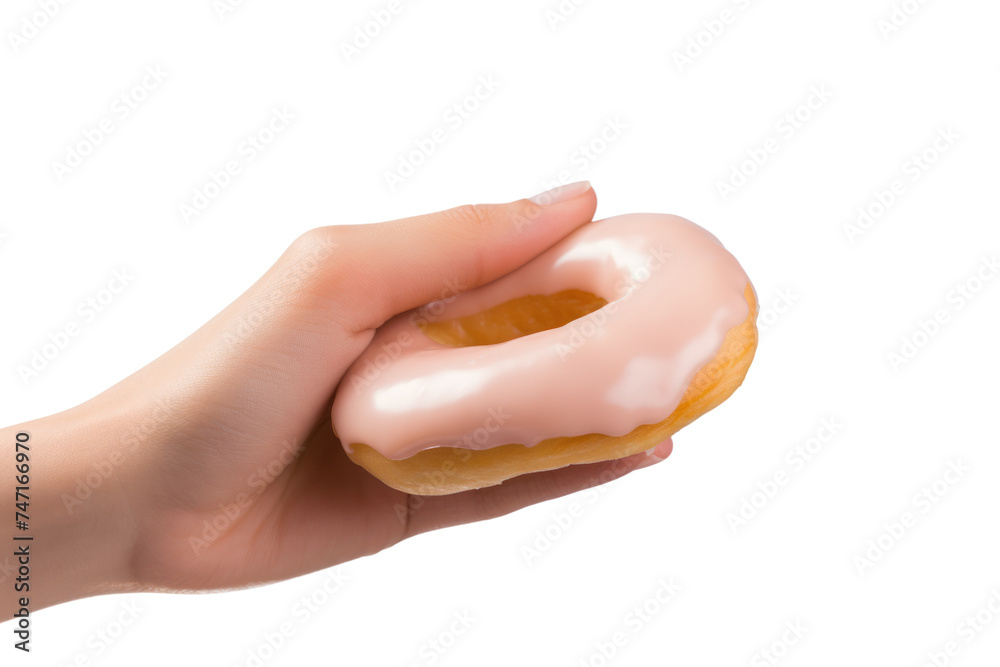 woman's hand holding a delicious donut. isolated on transparent and white background.PNG image. woman's hand holding a delicious donut. isolated on transparent and white background.PNG image.