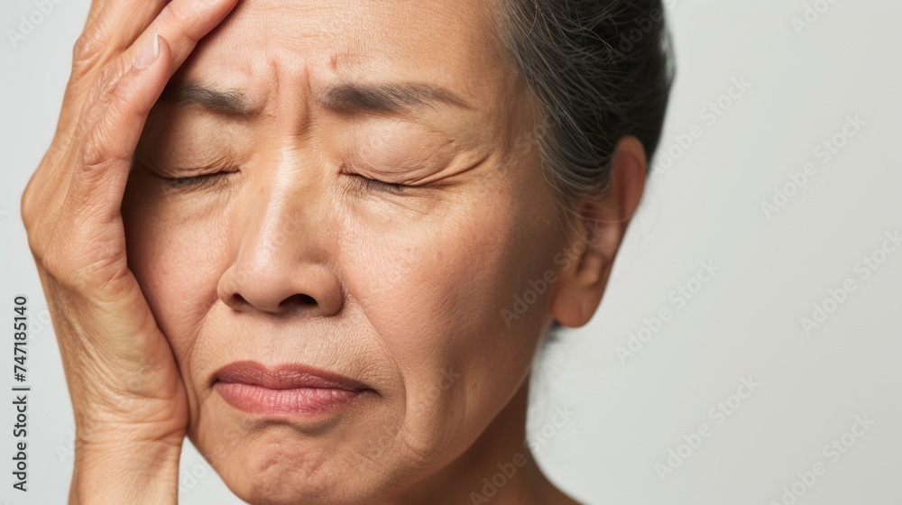 Woman with closed eyes hand on forehead looking distressed or deep in thought. Woman with closed eyes hand on forehead looking distressed or deep in thought.
