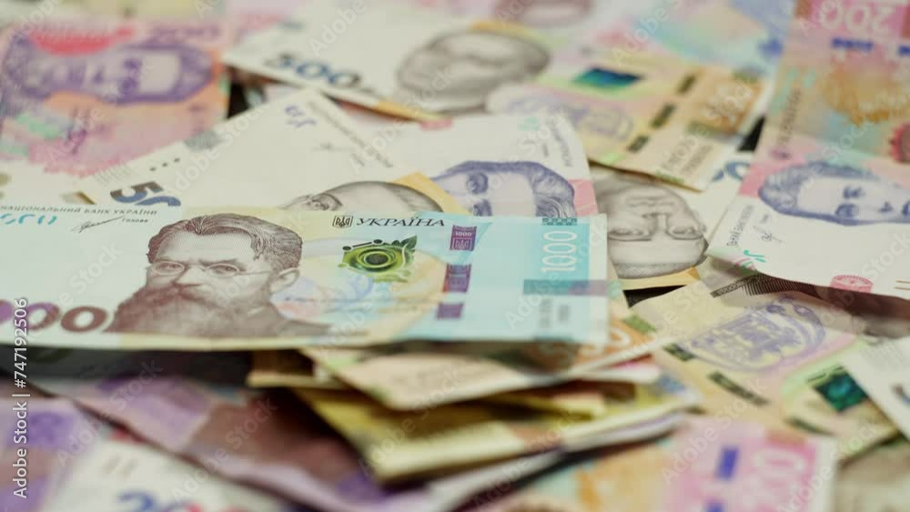 Banknotes, an indicator of economic activity, are spread out on the table. This indicates strong entrepreneurial activity and influence on the market. High quality 4k footage Banknotes, an indicator of economic activity, are spread out on the table. This indicates strong entrepreneurial activity and influence on the market. High quality 4k footage
