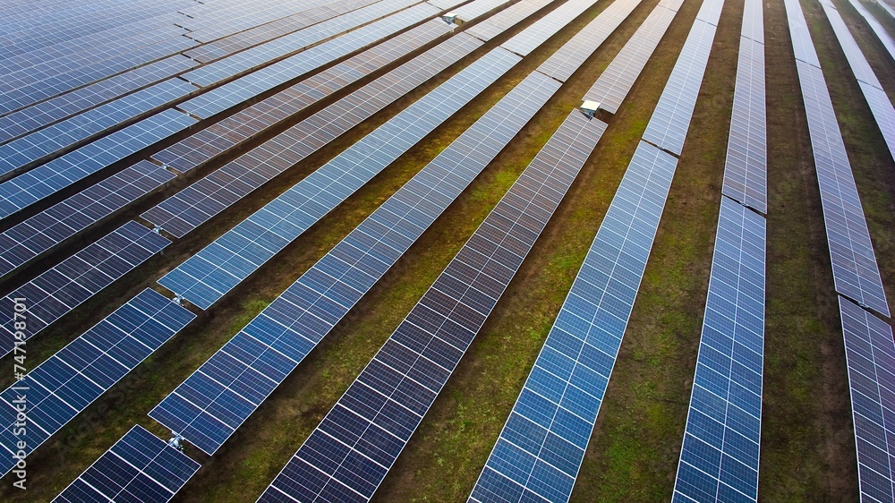 A photo of a large, modern photovoltaic farm. A photo of a large, modern photovoltaic farm.