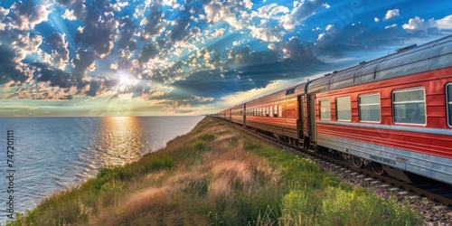 Beautiful scene of evening sunset with train on the railway, train travel 