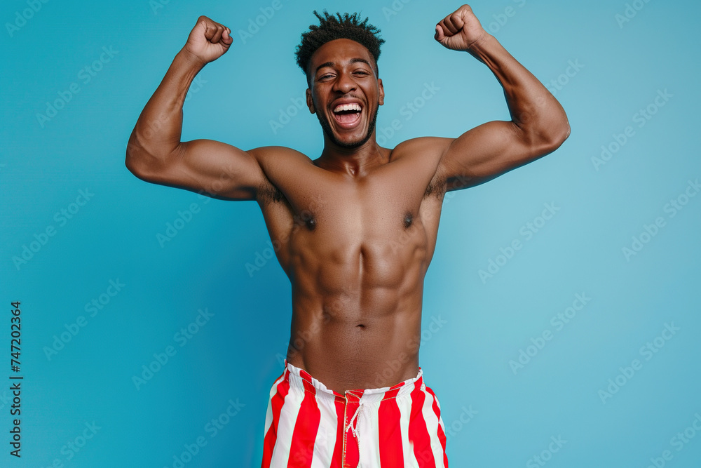Photo African American guy fist up scream yes swimmer ocean distance win wear red striped set shorts isolated vivid color background