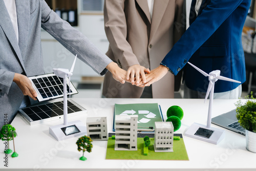 Business team people planning and discussing on recycle reduce reuse policy symbol in office meeting room. Green business company and Solar Energy Environment city