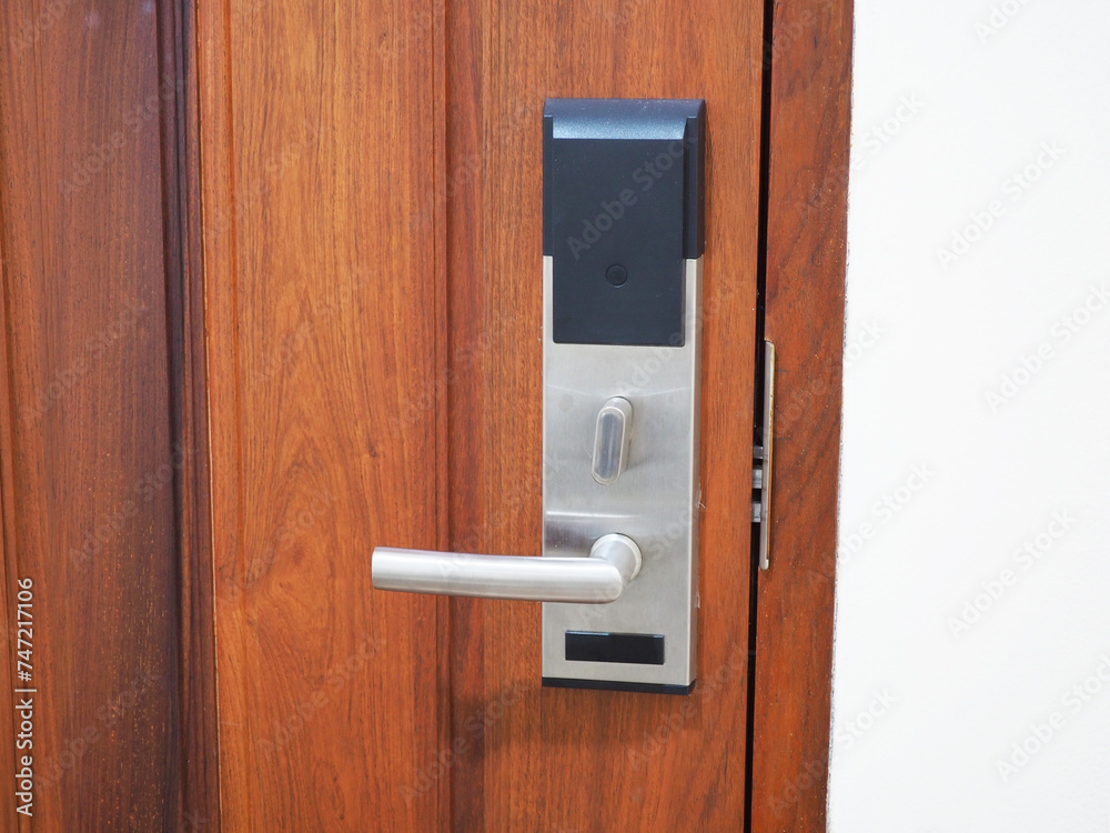 Entrance wooden door with electronic keycard lock system. Entrance wooden door with electronic keycard lock system.