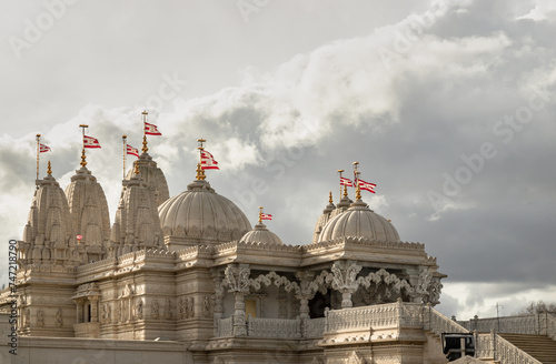 The exterior architectural design of the Neasden temple (BAPS Shri Swaminarayan Mandir) with sky background. Hindu temple in Neasden to build is constructed from Italian Marble, hand carved in India,  photo