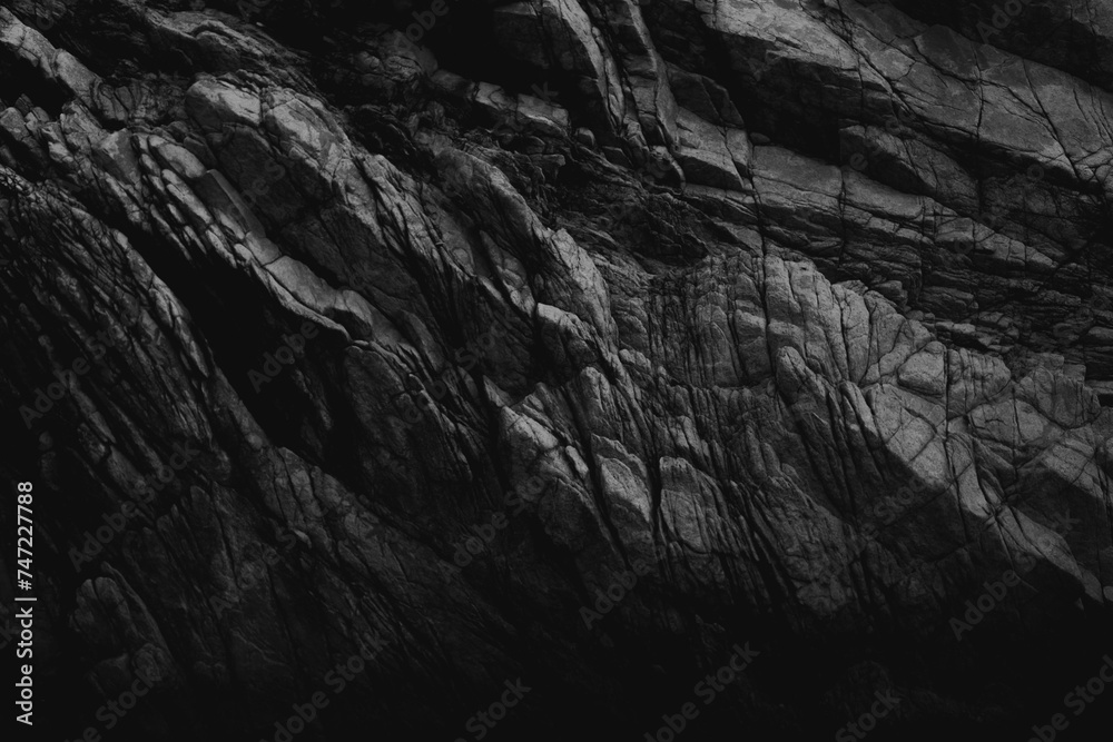 Stone wall texture, Sea rock wall in black and white. Elegant, bizarre and original wallpaper.