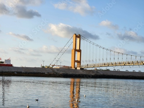 Dwarka, Gujarat India - Feb 21 2024: Sudama Setu Bridge over Gomati river ghat near Dwarkadhish temple which is one of chardhams dedicated to lord Krishna. photo