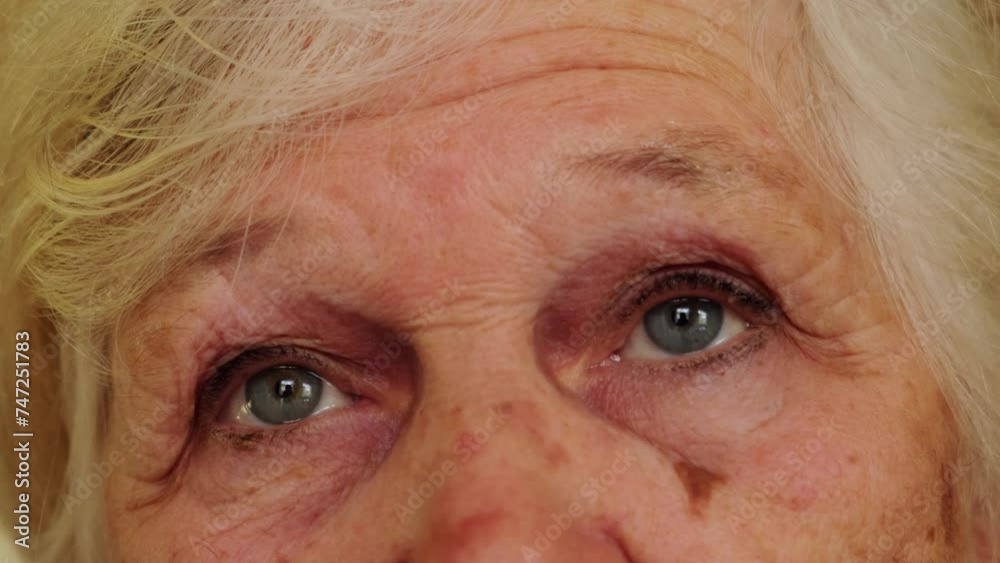 Elderly caucasian woman eyes close-up. Sad and wise look of an old grandmother. Grandparents day concept. Elderly caucasian woman eyes close-up. Sad and wise look of an old grandmother. Grandparents day concept.