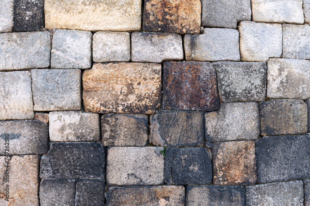 Pattern of grey wall surface, made of artificial stone of different sizes. Hwaseong Fortress or Suwon Hwaseong wall, South Korea Pattern of grey wall surface, made of artificial stone of different sizes. Hwaseong Fortress or Suwon Hwaseong wall, South Korea