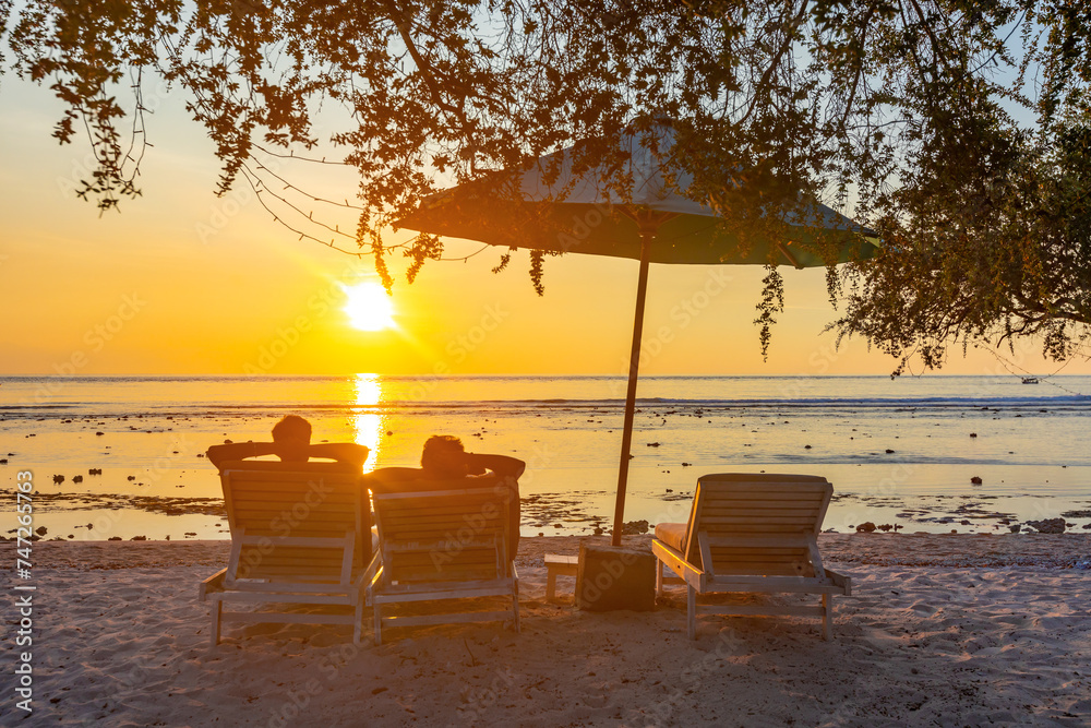 Tropical beach landscape at sunset, gili, indonesia